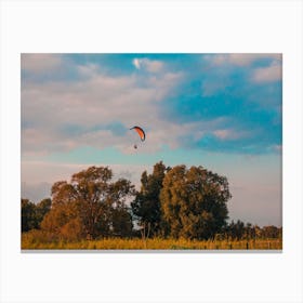 Motorized Paraglider Flying In Rural Area During Sunset Canvas Print