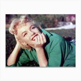 Actress Marilyn Monroe Poses For A Portrait Laying On The Grass In 1954 In Palm Springs Canvas Print