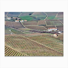 Langhe Rolling Vineyards in Early Spring. Langhe, Italy. An aerial view of beautifully contoured vineyards, showcasing rows of neatly planted vines stretching across rolling hills. The alternating shades of green and earthy tones create a mesmerizing pattern, highlighting the precision and artistry of vineyard cultivation. This serene landscape captures the essence of rural life in a wine-producing region. 4 Canvas Print