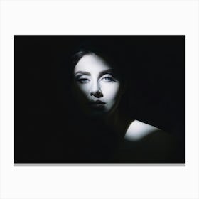 Portrait Of An Enigmatic Face Caught Halfway Between Light And Shadow One Side Fully Illuminated Re 1 Canvas Print