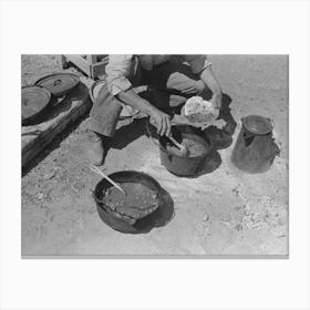 Cowboy Dishing Up Chili At Noonday Dinner, Cattle Ranch Near Marfa, Texas By Russell Lee Canvas Print