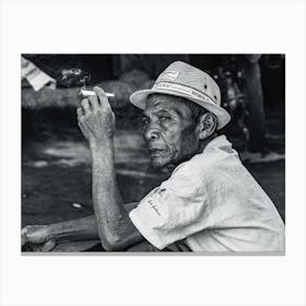 Old Man Smoking A Cigarette Canvas Print