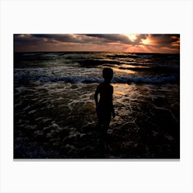 Young Boy Looking At The Sunset Canvas Print