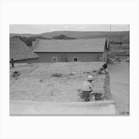 Spanish American Children Replastering Corner Of Roof Of Adobe House, Costilla, New Mexico By Russell Lee Canvas Print