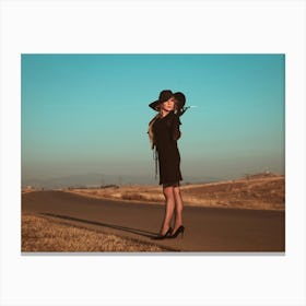 Woman In Black Hat On The Road Canvas Print