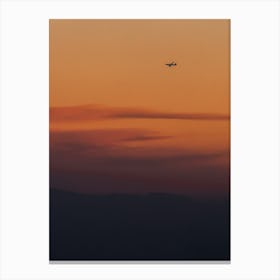 Airplane In The Sky At Sunset Canvas Print
