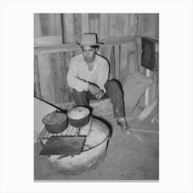 Mexican Man Sitting By Makeshift Cooking Stove, It Is Not Unusual To Find Mexicans Cooking Over These Fires And Canvas Print
