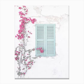 Bougainvillea plant on a Mediterranean house wall santorini door window Canvas Print