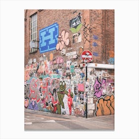 London, England I Colorful retro street art and urban graffiti on brick wall of Shoreditch streets with the industrial architecture and mural design vibrancy of London's suburbs urban exploration photography Canvas Print