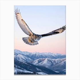 Owl With Piercing Yellow Eyes Mid Flight Over Snowy Mountains At Sunrise Wings Outstretched In A S Canvas Print