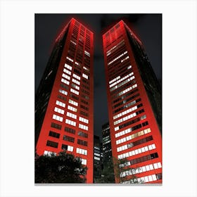 Two Buildings Lit Up In Red Canvas Print