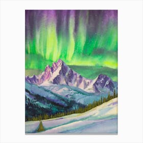 Aurora Borealis Over A Snowy Mountain Range Canvas Print