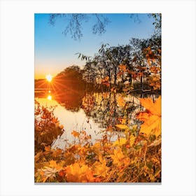 Sunset on lake water with tree at fall season Canvas Print