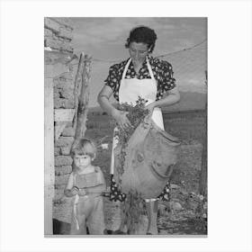 Spanish American Woman And Her Son With Greens Which They Feed To Their Rabbits Near Taos, New Mexico By 1 Canvas Print