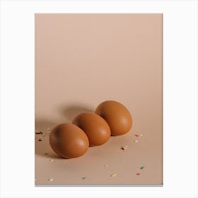 Three Brown Eggs On A Beige Background Canvas Print