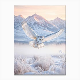 Snow Owl Yellow Eyes In Flight Above Morning Frost Kissed Snow Backdrop Of White Snowy Mountains Canvas Print