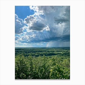 Cumulus Clouds Dominating A Spring Landscape Sunlight Peeks Through The Overcast Sky Casting A Mos (1) Canvas Print