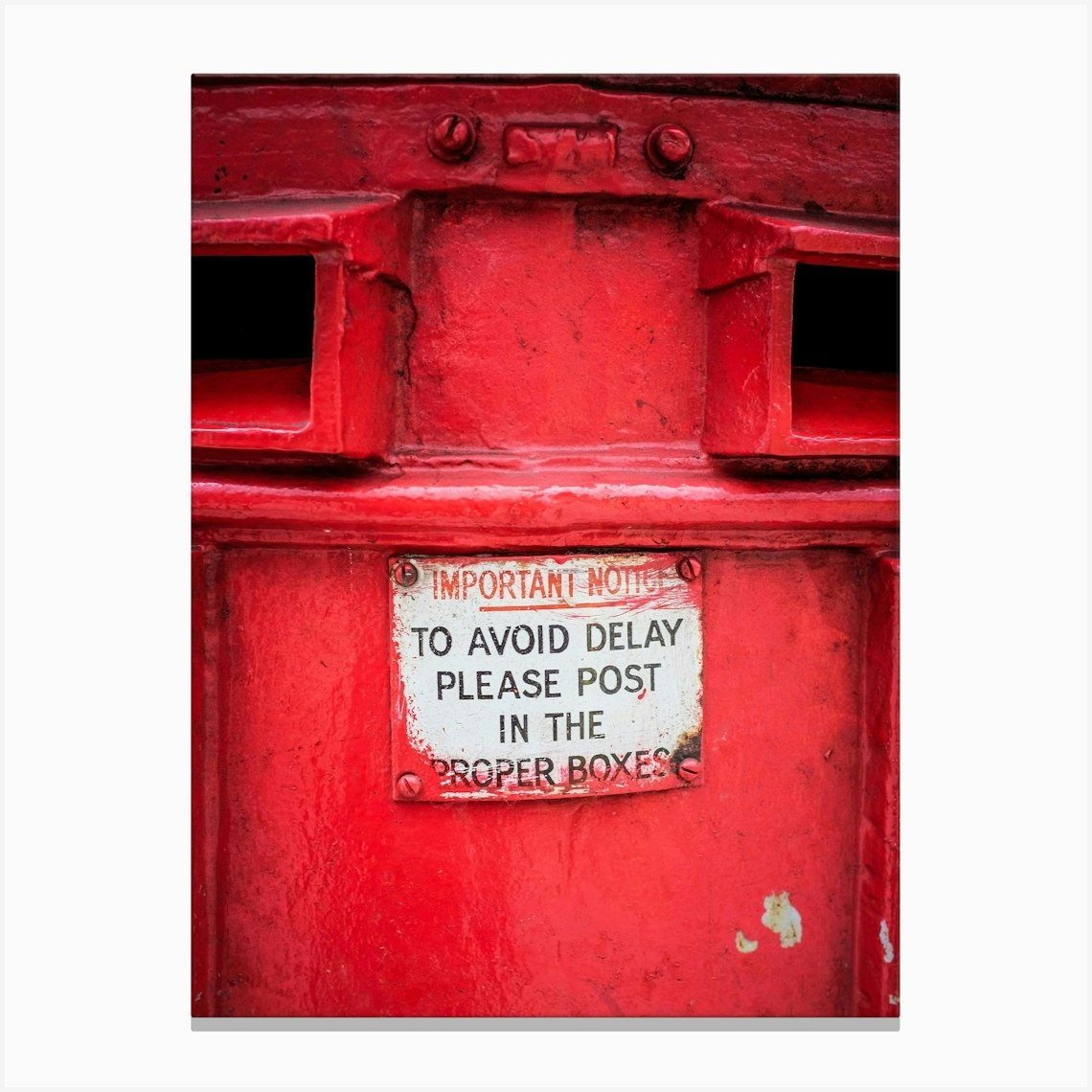 Red Postbox Details Canvas Print by Paul J Bucknall