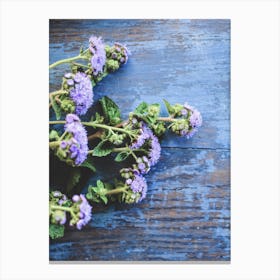 Blue Flowers On A Table Canvas Print