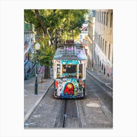 A streetcar sprayed with graffiti in Bairo Alto in Lisbon - summer street and travel photography by Christa Stroo Canvas Print