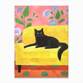 Black Cat Sitting In A Yellow Armchair Canvas Print