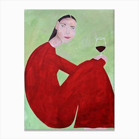 Woman in red with a glass of wine on a green background Canvas Print