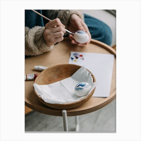 Woman Paints On A Table Canvas Print