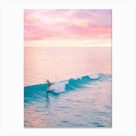 Surfer Riding A Wave At Sunset Canvas Print