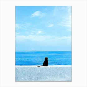 Cat watching the sea Canvas Print