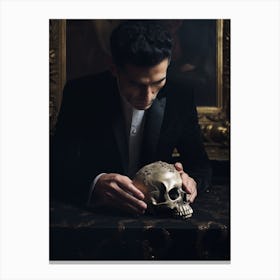 An Actor Is Holding A Hand Of A Skull On A Table Canvas Print