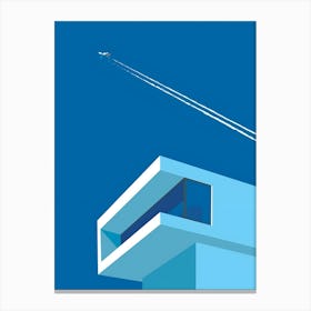 Airplane Flying Over A Building Canvas Print