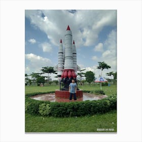 Artificial Space shuttle in a park covering a vibrant blue sky Canvas Print