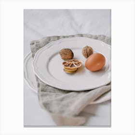 White Plate With Nuts And Eggs Canvas Print