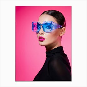 Portrait Of A Model With Blue Eyes Donning Pink Glasses And Pink Lips Set Against A Pink Background Canvas Print