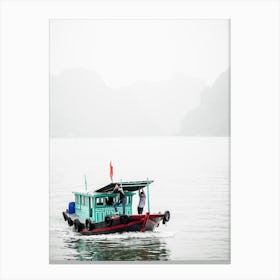 Small Boat On A Misty Halong Bay Vietnam Canvas Print