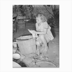 Daughter Of Migrant Family Wiping And Packing Dishes Preparatory To Leaving For California From Muskogee, Oklahoma Canvas Print