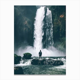 Man Standing In Front Of Waterfall Canvas Print