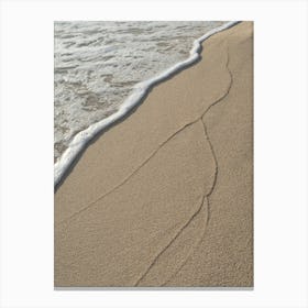Traces of waves in the fine sand Canvas Print
