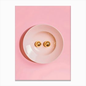 Golden Spoons On A Pink Plate Canvas Print