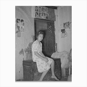 Mexican Girl Sitting In Front Of Bedspring Which Formed Partition Between The Family S Living Quarters And Those Of A Canvas Print