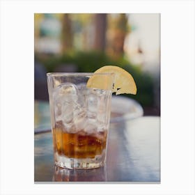 Glass With Cola And Ice And Lemon On A Table Outside Canvas Print