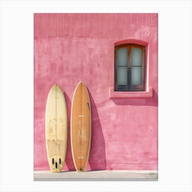 Two Surfboards Leaning Against A Pink Wall Canvas Print