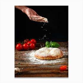 A Hand Stretching A Glistening Ball Of Pizza Dough Mid Action Flour Dusting In The Air From A Woode (2) Canvas Print