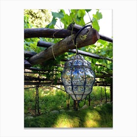 Glass Lantern Hanging From Vines Canvas Print