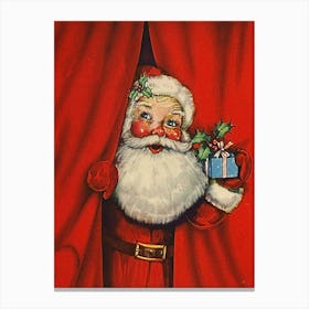 Santa Claus Behind Red Curtain With A Present For You Canvas Print