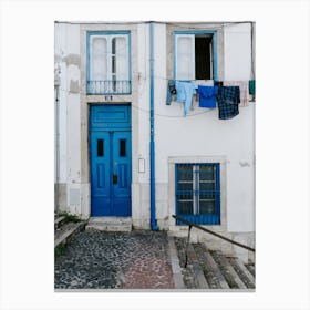Blue laundry in Lisbon Canvas Print