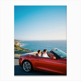 Couple Basks In Golden Hour Glow As They Drive A Vibrant Red Convertible Down A Coastal Highway Cli (4) Canvas Print