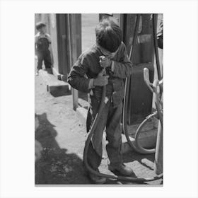 Mexican Migrant Boy Drinking Out Of Water Hose At Filling Station Where The Truck Which Is Taking Him Home From Canvas Print