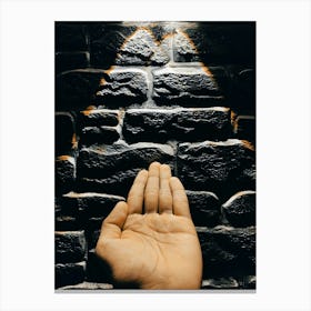 Hand Reaching Up To A Brick Wall Canvas Print