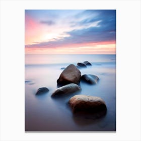 Rocks On The Beach At Sunset Canvas Print